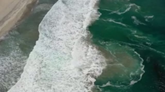LOS CABOS MEXICO-2020: Aerial View Coming Down To The Crashing Waves Meeting A