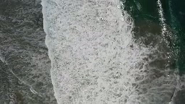 LOS CABOS MEXICO-2020: White Waves Crashing Along The Shore Of A Dark Ocean