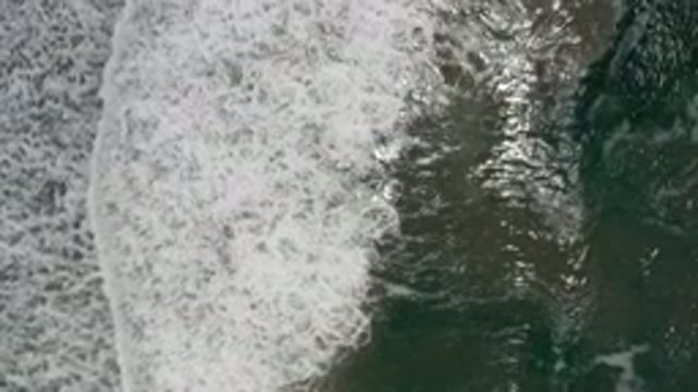 LOS CABOS MEXICO-2020: Sky View Of Clean And Clear Waves Crashing Against The