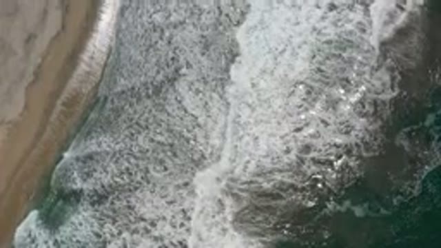 LOS CABOS MEXICO-2020: The Final Breaking of Waves on a Hot Sunny Day at Beach