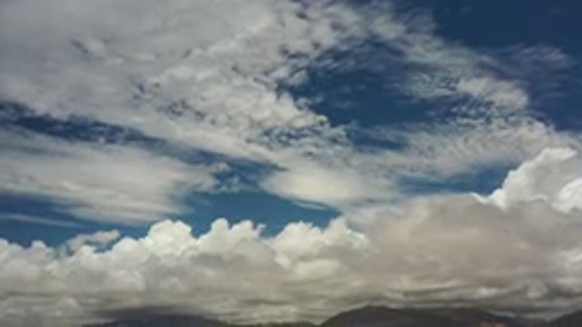 LOS CABOS MEXICO-2020: Beautiful Sunny Day With White Clouds And A Mountain