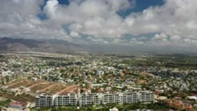 LOS CABOS MEXICO-2020: The Top View Of The White Cloud Sky And Tallest Buildings