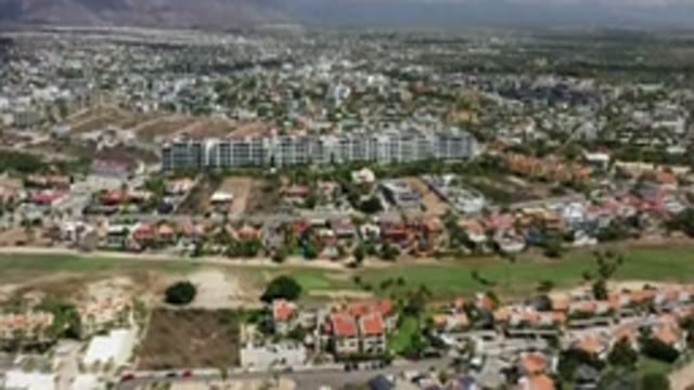 LOS CABOS MEXICO-2020: Top View Of Tallest Buildings And Green Ground