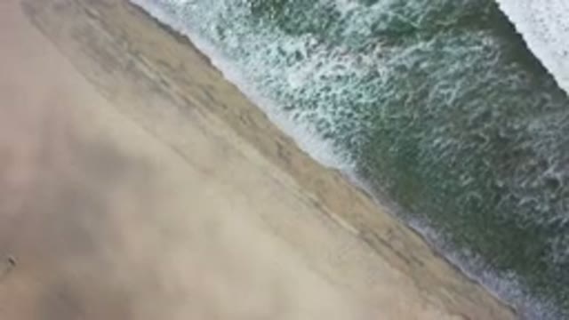 LOS CABOS MEXICO-2020: Top View of White Waves and Beach Sand