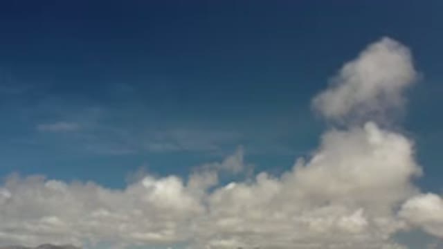 LOS CABOS MEXICO-2020: Blueish Sunny Cloudy Sky On Mountains