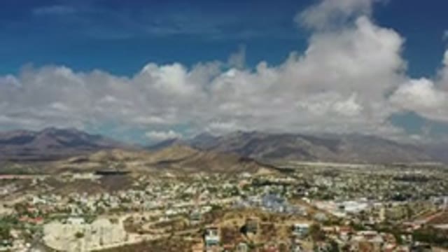 LOS CABOS MEXICO-2020: City Cape Against Sprawling Mountain Backdrop