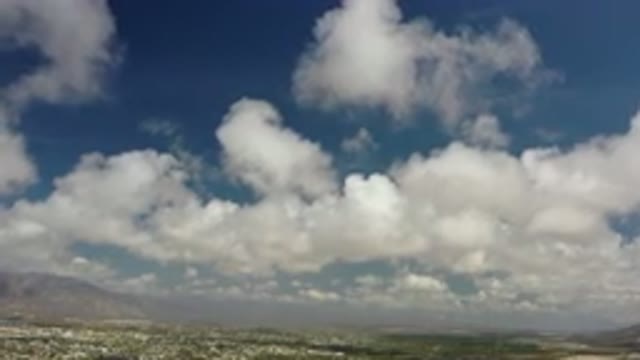 LOS CABOS MEXICO-2020: Bright White Clouds Hanging Under A Blue Sky And Over A Desert Landscape