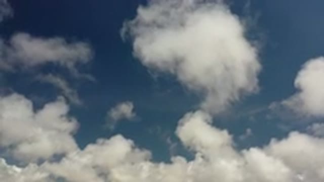 LOS CABOS MEXICO-2020: White Round Clouds Move Through Clear Blue Sunny Sky