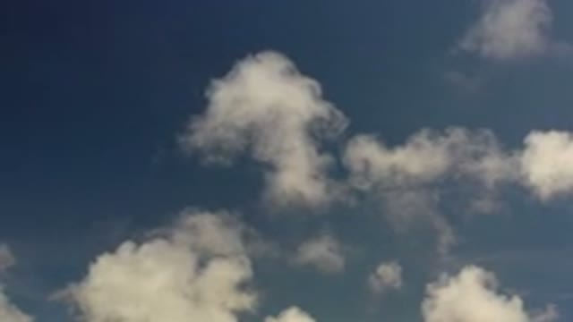 LOS CABOS MEXICO-2020: When Looking Up At The Sky White Fluffy Clouds Slowly Move