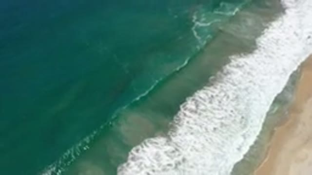 LOS CABOS MEXICO-2020: Drone Shot Of Blue Ocean Waves Crashing Into The Shore
