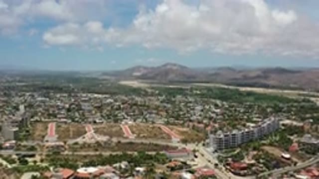 LOS CABOS MEXICO-2020: Flyover Video Of City And Mountains With Clouds In Sky