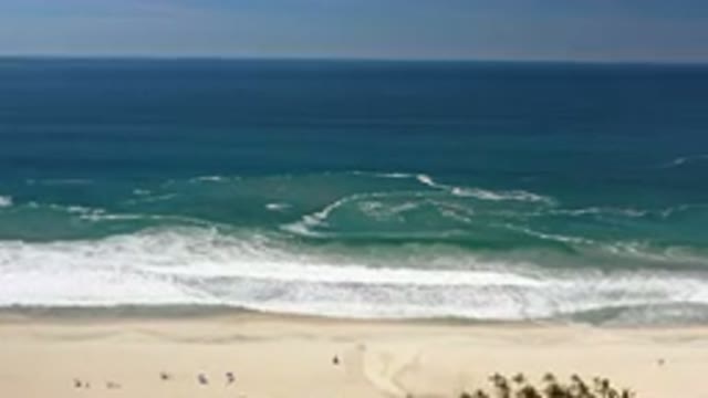 LOS CABOS MEXICO-2020: Waves Crashing On Sandy Beach Being Enjoyed By Many Beachgoers