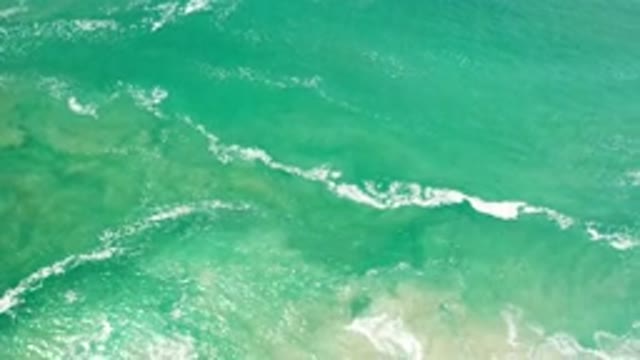 LOS CABOS MEXICO-2020: A Mesmerizing Aerial View Of The Ocean As The Waves Begin