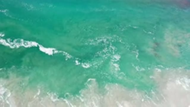 LOS CABOS MEXICO-2020: Blue And White Waves Crashing On The Shore Of A Clear