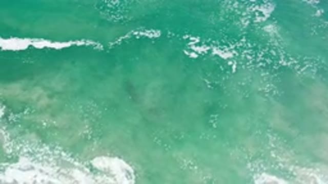 LOS CABOS MEXICO-2020: Calm Turquoise Ocean Waves Sparkling And Moving To The Shore