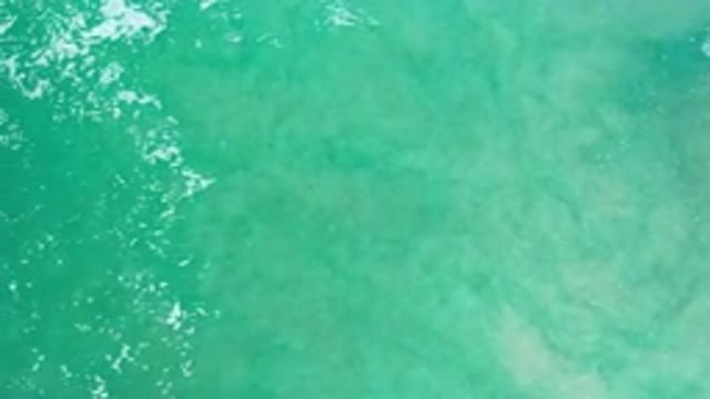 LOS CABOS MEXICO-2020: Green Sea With White Crests Rolling From Deep Into Shallows