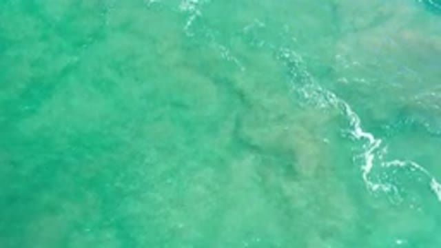 LOS CABOS MEXICO-2020: White Waves Rolling Through Crystal Green Water With Rock Formations