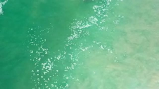 LOS CABOS MEXICO-2020: Seafoam Green Ocean Flowing Water Waving Back And Forth
