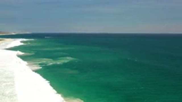 LOS CABOS MEXICO-2020: Blue Green Ocean Waves Meeting The Shore With White Caps
