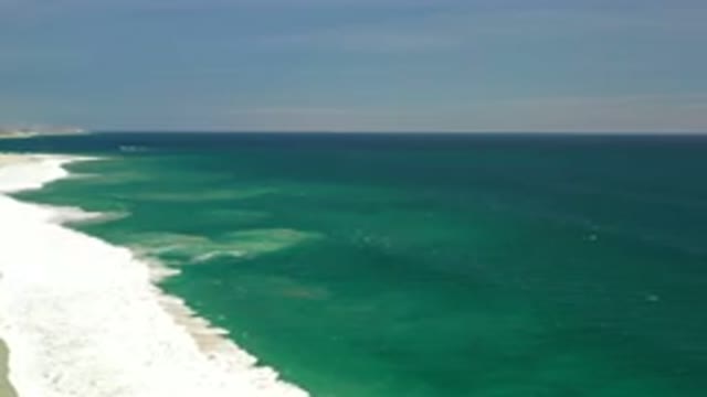 LOS CABOS MEXICO-2020: Isolated White Beach With Green Waves Rolling Into Shore
