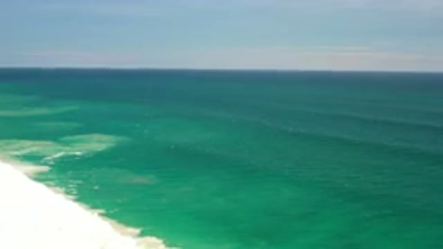 LOS CABOS MEXICO-2020: A Calm Blue Green Ocean Washing Gently To The Shore In