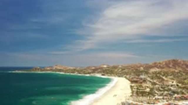 LOS CABOS MEXICO-2020: A Bird's Eye View Of The Ocean Shore Outlined By A Resort