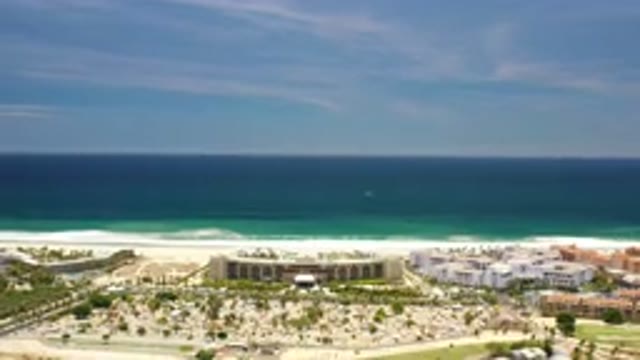 LOS CABOS MEXICO-2020: Drone Shot Of A Beach City With The Vast Ocean Behind It