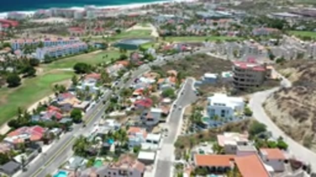 LOS CABOS MEXICO-2020: Aerial View Of A Town At The Base Of A Mountain Near The Shore