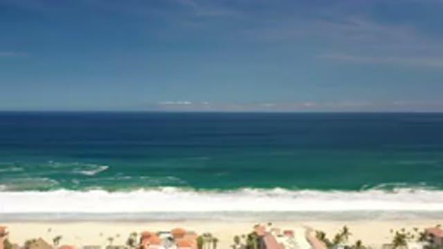 LOS CABOS MEXICO-2020: A Beach-side View Of The Ocean With Waves Crashing Along