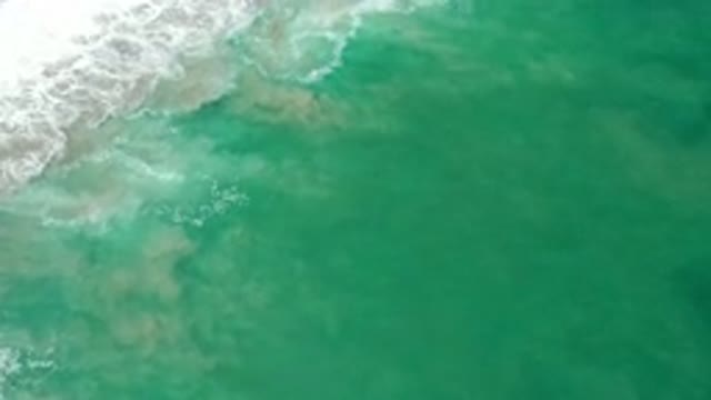 LOS CABOS MEXICO-2020: Sea Water Near The Shore Getting Mixed With The Sand And