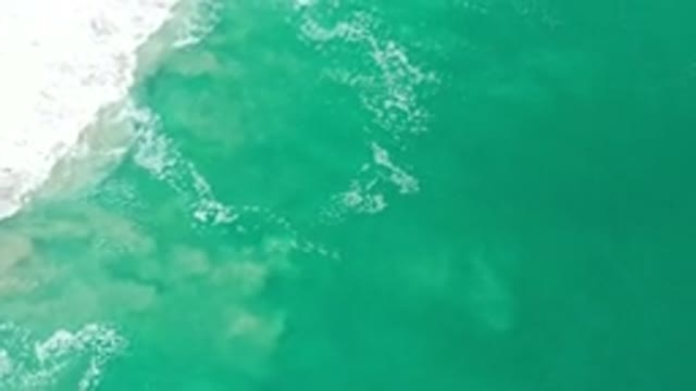 LOS CABOS MEXICO-2020: Crashing Blue Green Ocean Waves With Churning Sand White