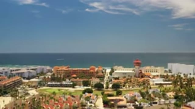 LOS CABOS MEXICO-2020: Sea Town Buildings Courtyard Towers Panning To Dark Blue