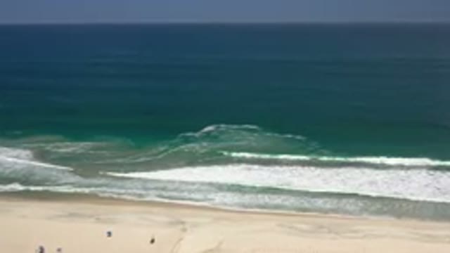 LOS CABOS MEXICO-2020: Large Waves Crashing On Beach With People Enjoying The