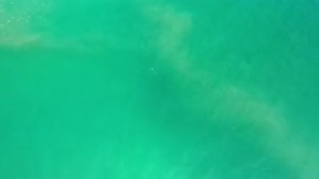 LOS CABOS MEXICO-2020: Moving Green Sea Water From Above Rippling And Showing