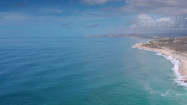 LOS CABOS MEXICO-2020: The Long View Of The White Clouds In Blue Sky And Blue Sea