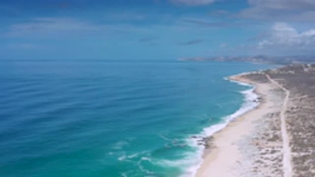 LOS CABOS MEXICO-2020: Aerial Footage Of A Camera Looking At A Sandy Beach Then
