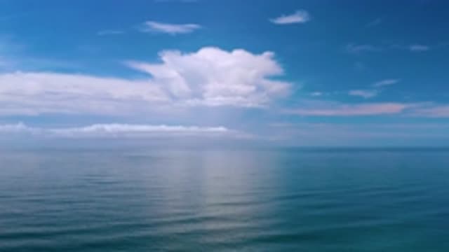 LOS CABOS MEXICO-2020: Shot Of A Vast Blue Ocean And Towering Clouds Overlooking