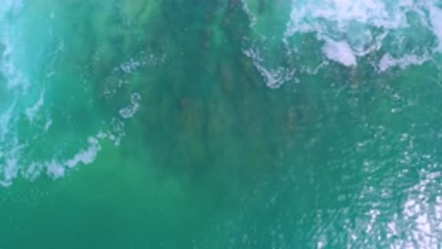 LOS CABOS MEXICO-2020: Blue And Crystal Clear Sea With Its Waves Breaking Over A
