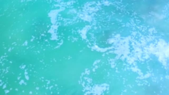 LOS CABOS MEXICO-2020: Calm Waves Of A Blue And Crystalline Sea Formed Foams
