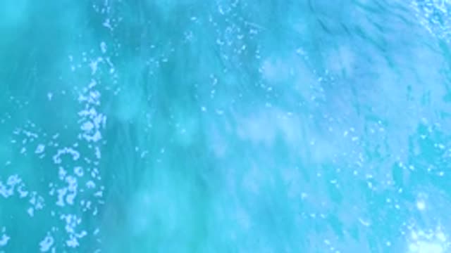LOS CABOS MEXICO-2020: Blue Foam Chain Waves Green Illuminated Day Sunny Summer