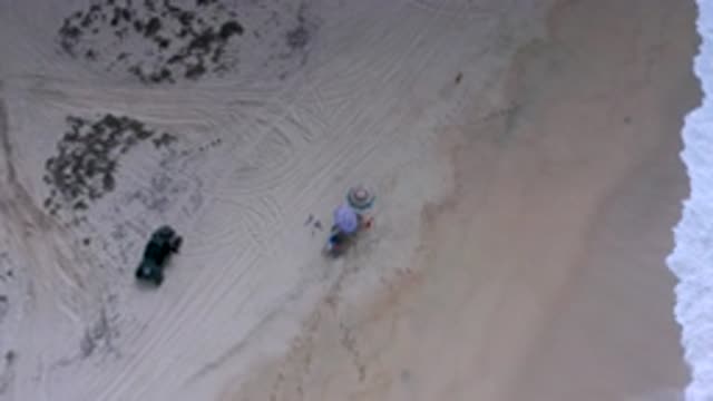 LOS CABOS MEXICO-2020: People Vacationing At Sandy Beach Under Umbrella Relaxing