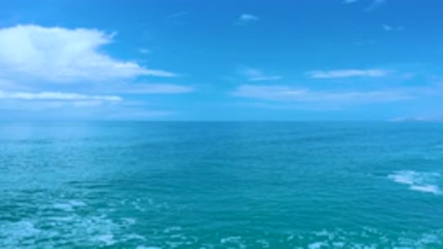 LOS CABOS MEXICO-2020: Small Waves Rolling Through Blue Water Under A Clear Blue Sky