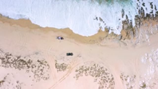 LOS CABOS MEXICO-2020: Beautiful Drone Shot Of The Beach Waves Crashing Into The Shore