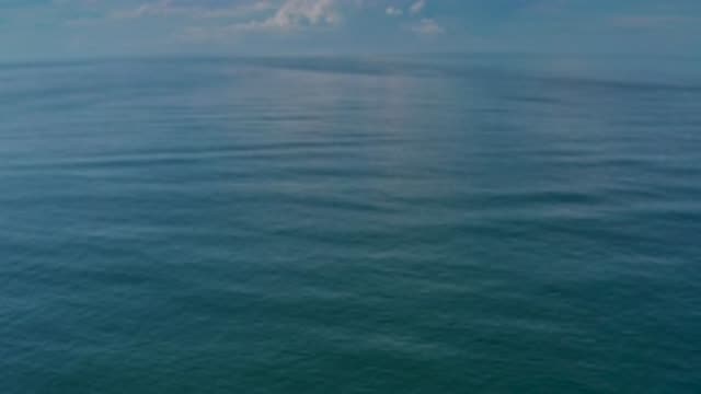 LOS CABOS MEXICO-2020: Relaxing Blue Sea Waving Under A Cloudy Sky In The Middle