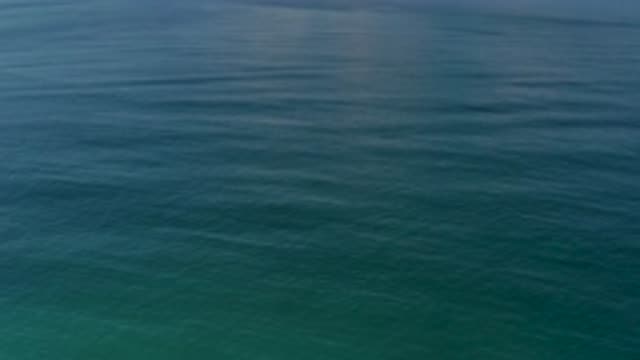 LOS CABOS MEXICO-2020: Blueish Green Ocean With Small Rolling Waves