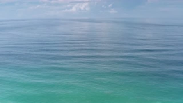 LOS CABOS MEXICO-2020: A Large Body Of Water With Slow Mo Sing Waves Under A