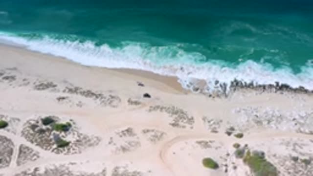 LOS CABOS MEXICO-2020: The Water Of The Ocean Rushing Towards The Shoreline