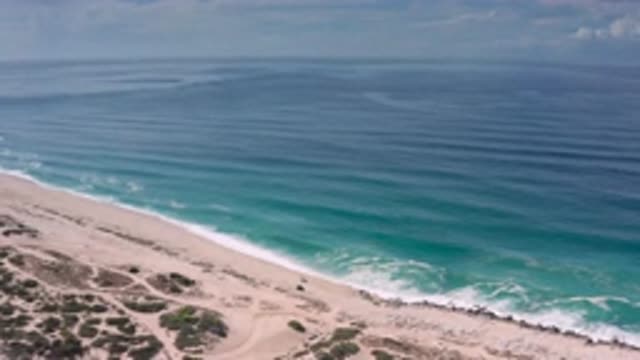 LOS CABOS MEXICO-2020: Sandy Beach With Gentle Ocean Waves Rolling In