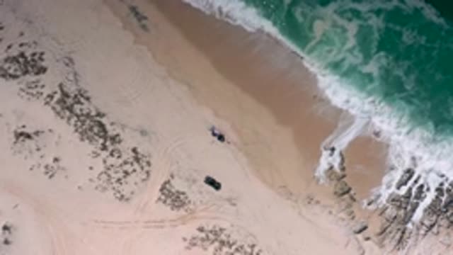 LOS CABOS MEXICO-2020: Sky View Of The Clear And Clean Ocean Waves Crashing Into