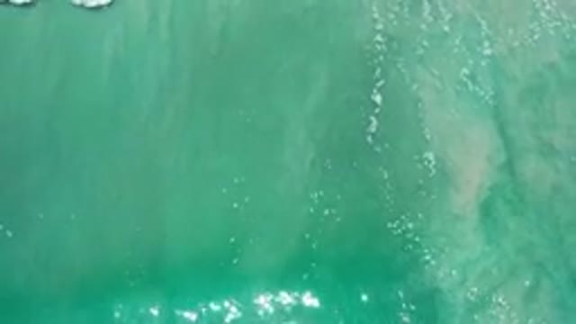 LOS CABOS MEXICO-2020: Overhead Shot Of Sparkling Green Ocean Surf Crashing On
